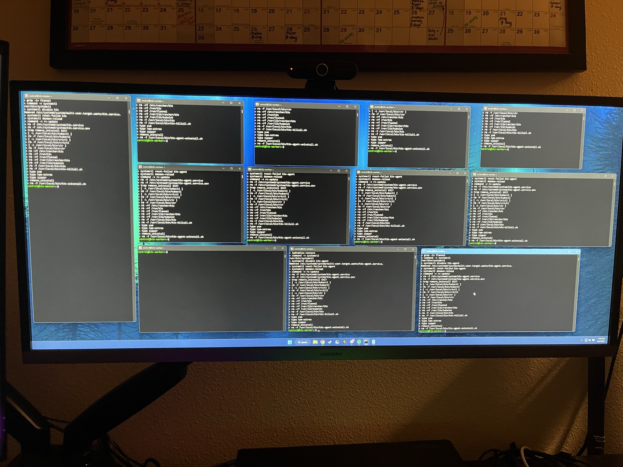 Twelve SSH sessions tiled across one monitor
